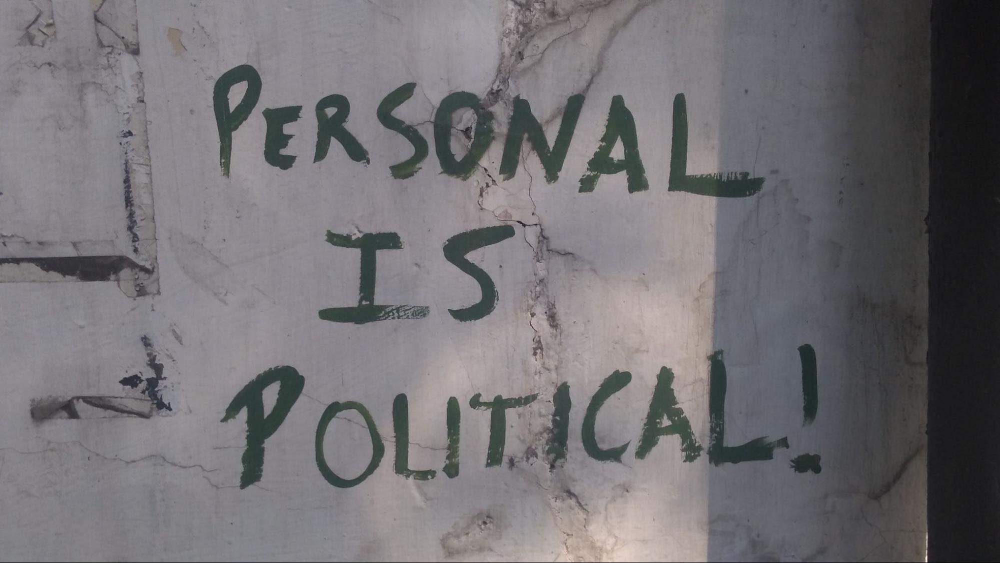 Photo of graffiti that says "personal is political!"