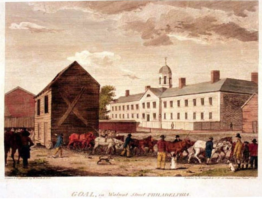 An illustration of the Walnut Street Jail (Gaol) in Philadelphia, Pennsylvania. Men and horses labor outside.