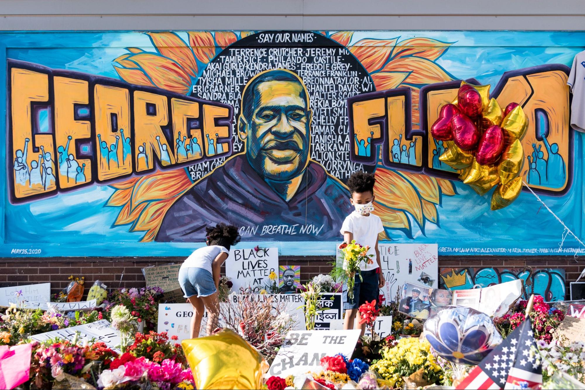 memorial mural with the name and image of George Floyd