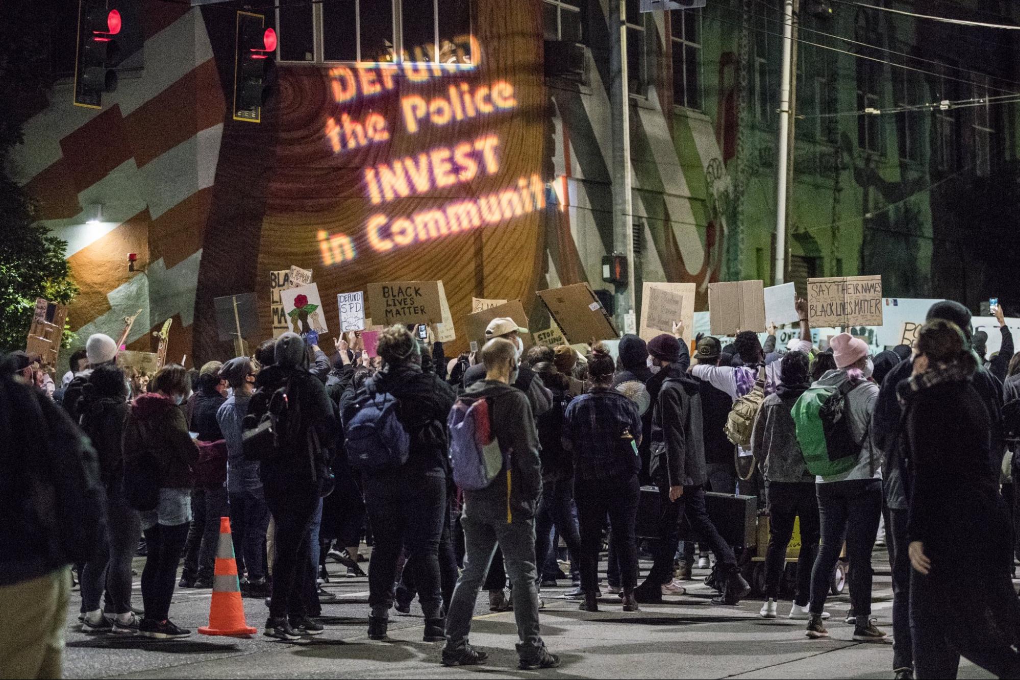 a group of protestors with signs