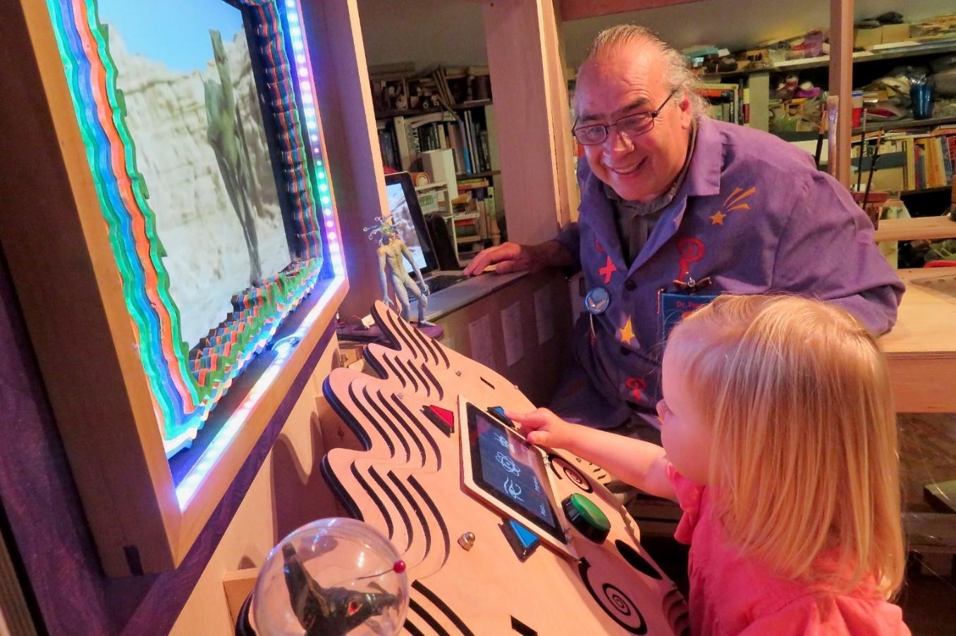 White female child pushes button on a game.