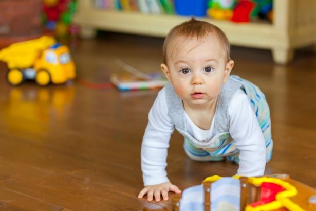 Toddler crawling on floor