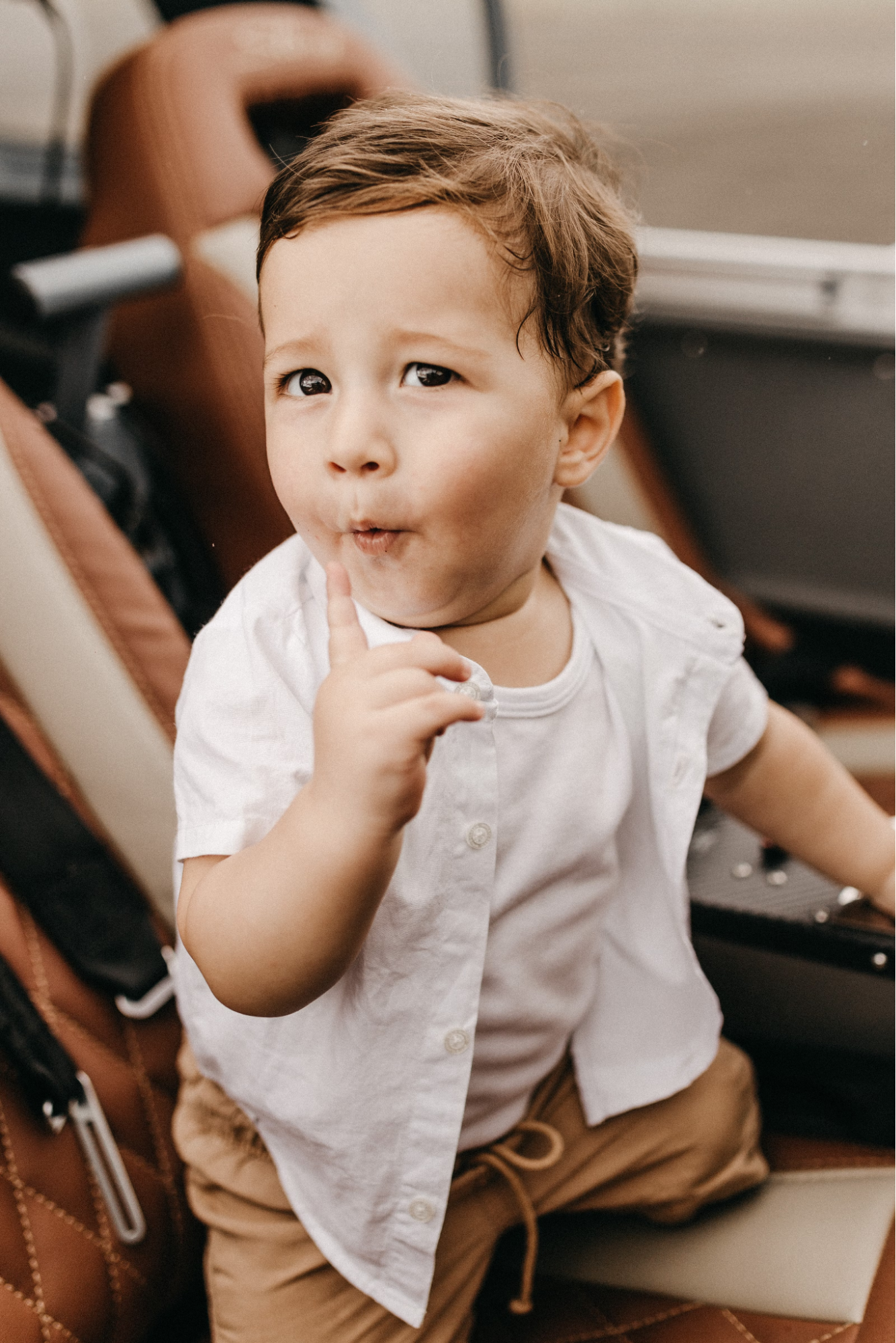 A child uses gestures to communicate with their caregiver