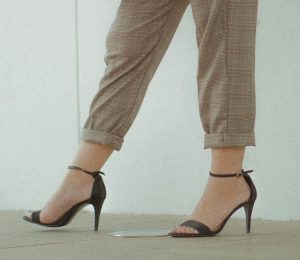 the legs of a woman wearing high heels