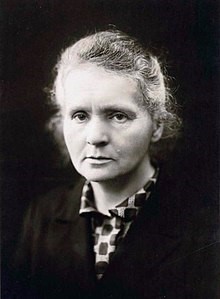 Black and white photo of woman frowning.