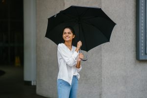 woman in rain with umbrella