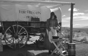 Pioneer woman with covered wagon