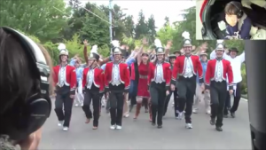 people dancing with a marching band