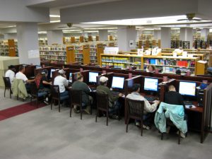 people working at computers in a computer lab