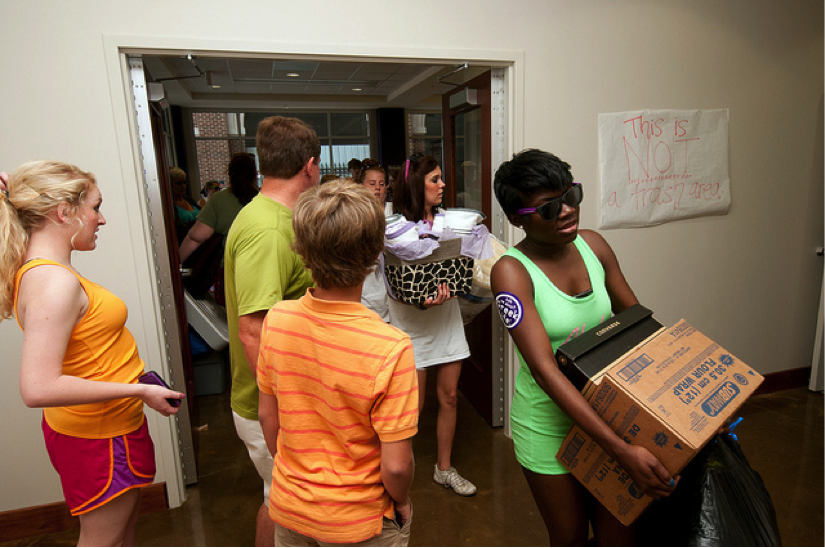 Students moving into a college dorm