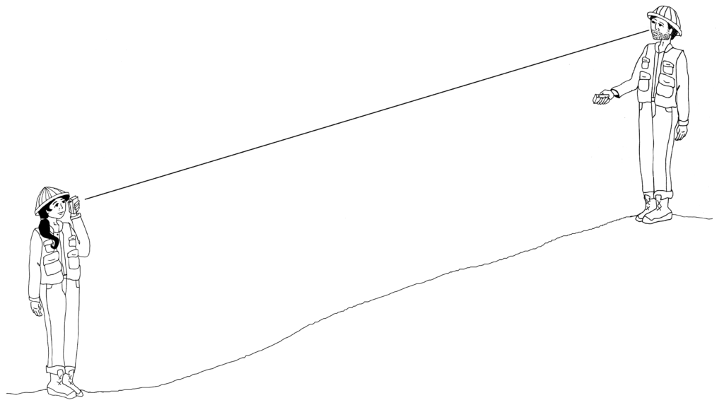 two people using clinometer to determine %slope on a hill